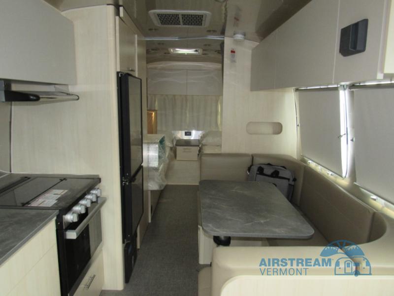 Airstream Flying Cloud 23FBT travel trailer interior with a U-shaped dinette and kitchen